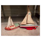 Vintage Wolverine Tug and toy sailboat