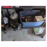 Shelf of Ratchet Straps and Propane Tank