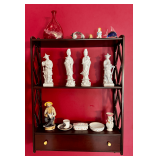 Shelf Display Featuring Ceramic and Glass Decor with Markings