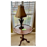 Mahogany Tilt-Top Pedestal Table with Claw Feet and Decorative Lamp
