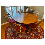 Round Oak Dining Table with Pedestal Base and Six Spindle-Back Chairs