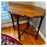 Wooden Side Table With Turned Legs and Curved Edge Design