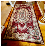 Rectangular Area Rug with Floral Patterns and Ornate Design