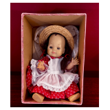 Vintage Doll with Red Dress, White Apron, and Straw Hat