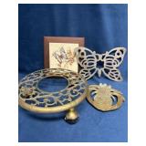 Three Trivets and Brass Wheeled Plant Stand