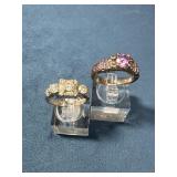 Two Sterling Silver Rings with Clear and Purple St