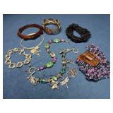 Jewelry Lot Including Bracelets, Charms, and Beade