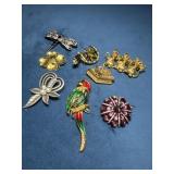Seven Vintage-Style Decorative Pins with Various M