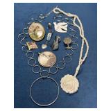 Pendants, Pins, and Necklaces with Various Designs