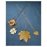 Four Vintage Gold Tone Chains and Pendants