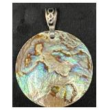 Unmarked Circular Iridescent Pendant with Metal Ba