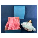 Collectible Porcelain Doll with Green Dress and Bo