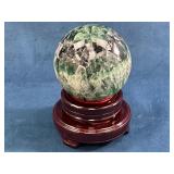 Polished Green Fluorite Sphere on Wooden Stand