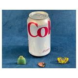 Three Miniature Objects with Can for Scale