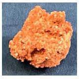 Natural Red Mineral Specimen on Dark Background