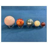Five Polished Stone Decorative Spheres With Stands