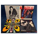 Four Vinyl Records by Herbie Mann, Al Jarreau, and
