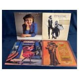 Four Vinyl Records Featuring Notable Artists and A
