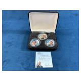 Three Barack Obama Commemorative Coins with Displa