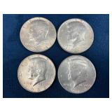 Four 1964 Kennedy Half Dollars