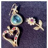 Three Gold Jewelry Items: Heart Pendant, Hummingbi