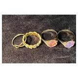 Four Gold-Tone Rings with Crystal and Heart Motifs