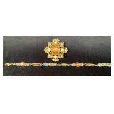 Gold-Tone Filigree Brooch with Gemstone Center and