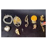 Pendants and Pins Featuring Various Materials and