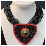 Multistrand Black Beaded Necklace With Large Red H