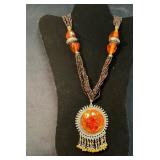 Multi-Strand Beaded Necklace With Amber Pendant an