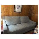 Light Gray Upholstered Three-Seat Sofa
