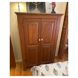 Wooden Cabinet With Two Paneled Doors and Shelves