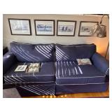 Blue Couch with Contrasting Piping and Visible Wea