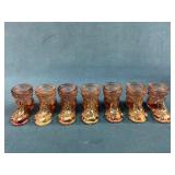 Seven Amber-Colored Glass Boot Shot Glasses with M