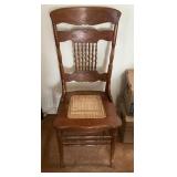Wooden Chair with Hand-Carved Details and Caned Se
