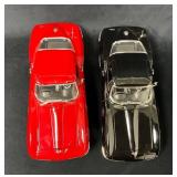 Two Diecast Model Cars Featuring Red and Black Des