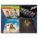 Four Vinyl Records Including ELO, Cat Stevens, and