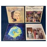 Four Vinyl Records Featuring Various Musical Style