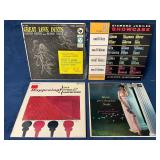 Four Vintage Vinyl Records with Original Sleeves