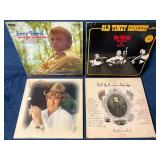Four Country and Folk Music Vinyl Records