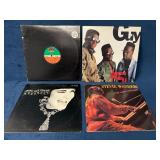 Four Vinyl Records Featuring Various Artists