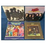 Four Vinyl LP Records Featuring Classic Rock Bands
