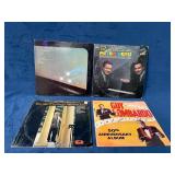 Four Vinyl Records Featuring Various Artists