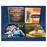 Four Vintage Vinyl Records Across Various Themes