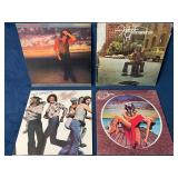 Four Vinyl Records Including Foghat, Chicago, and