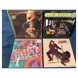 Four Vinyl Records Featuring Doc Watson and Other