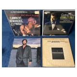 Four Vinyl Records Including Jazz and Rock Artists