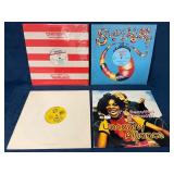 Four Vinyl Records Featuring Various Artists and G