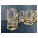 Four Etched Glass Beer Mugs with Elegant Designs