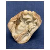 Carved Jade Sculpture Featuring Intricate Motifs